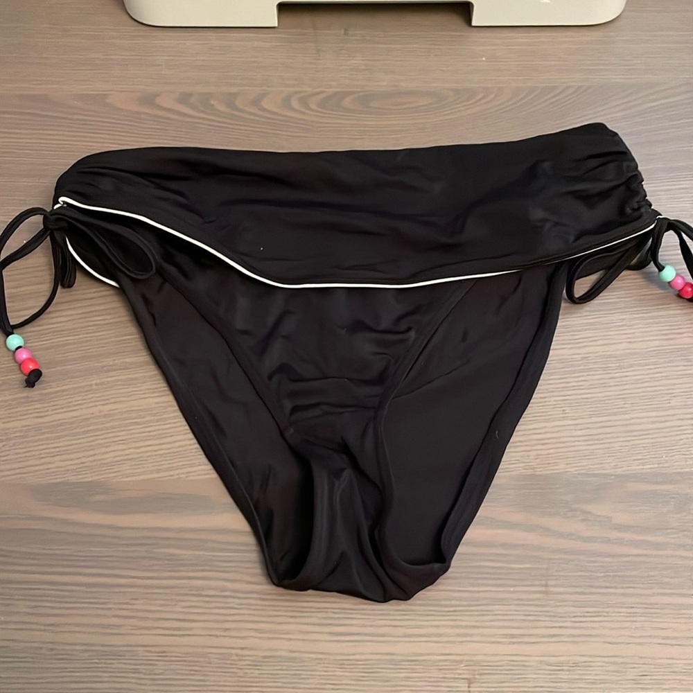 Black bikini bottom size 8 USA. Fold over waist with drawstring sides.
